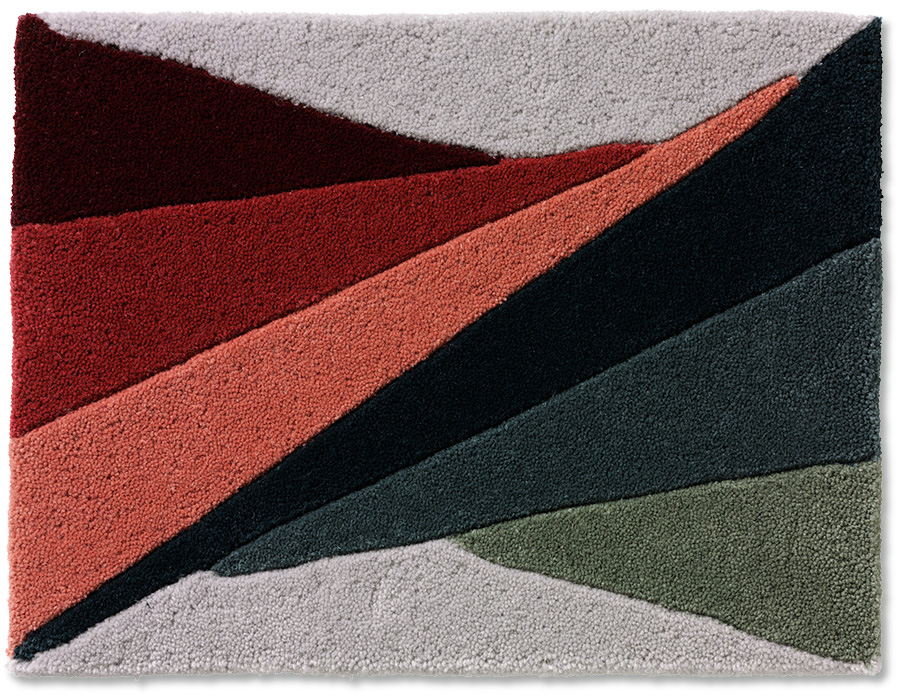 Handtuftad matta Vega i sju olika nyanser, rakad längs med färgfälten.